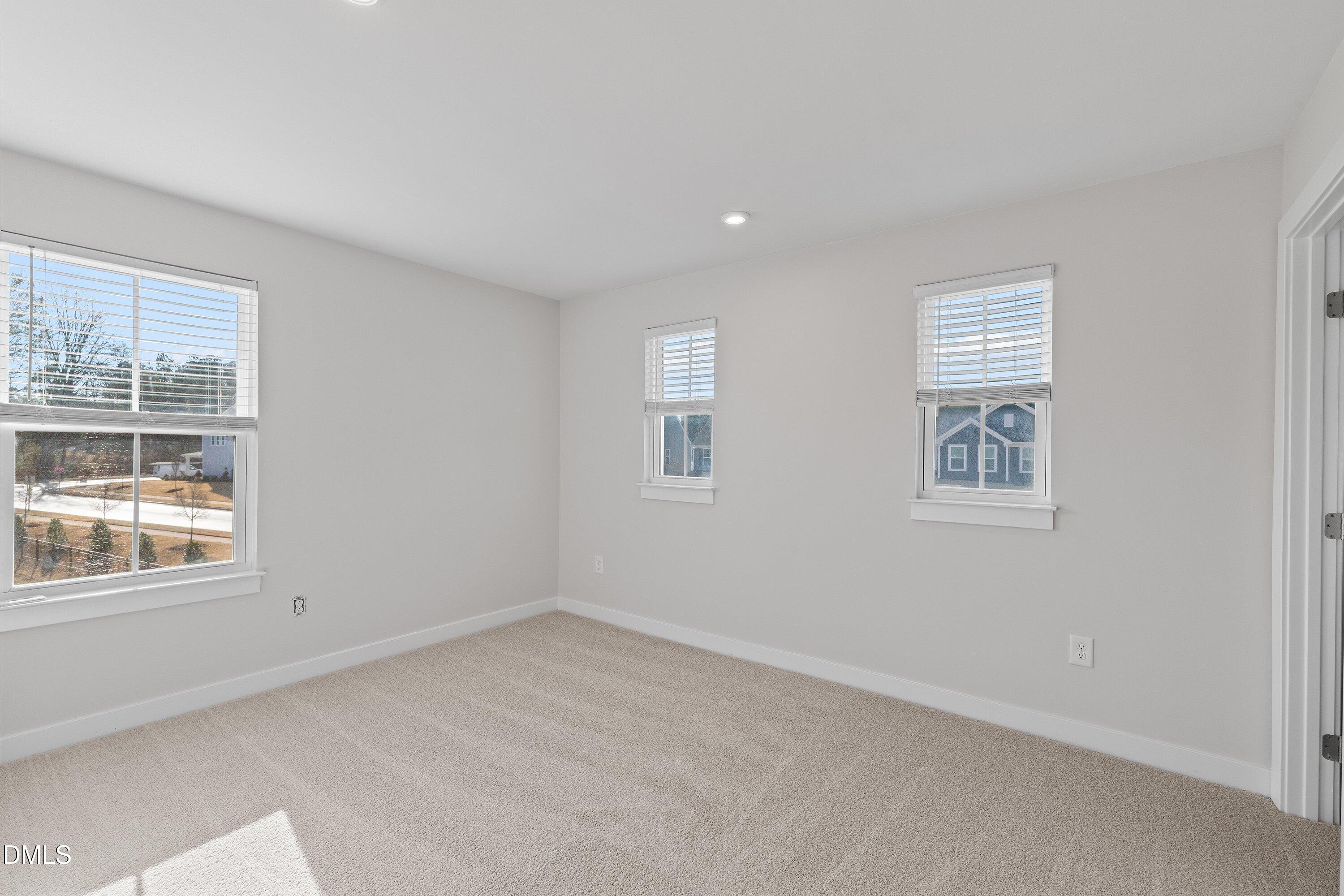 120 Misty Pike Drive Raleigh, NC 27603 - Photo 34 of 57 a view of empty room with windows