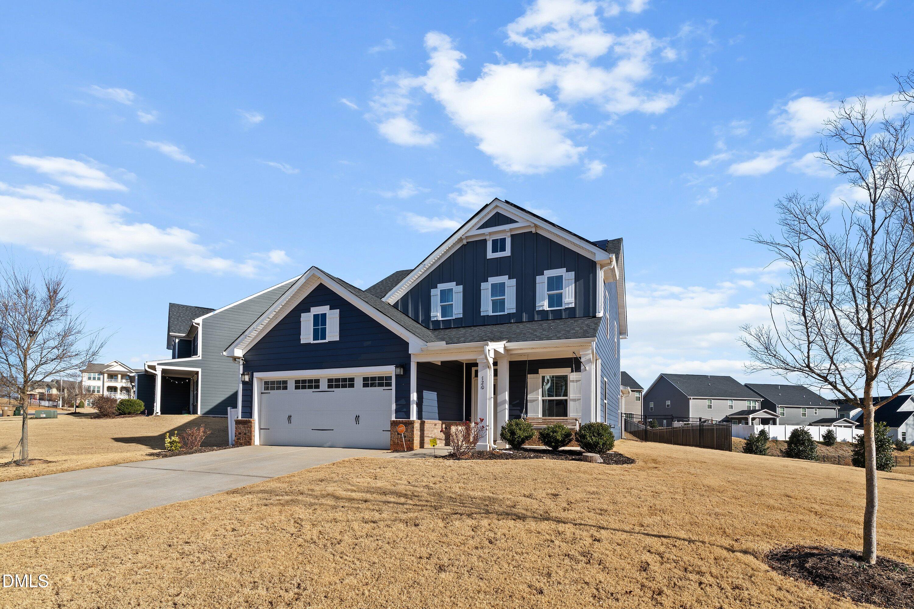 120 Misty Pike Drive Raleigh, NC 27603 - Photo 4 of 57 a front view of a house with a yard