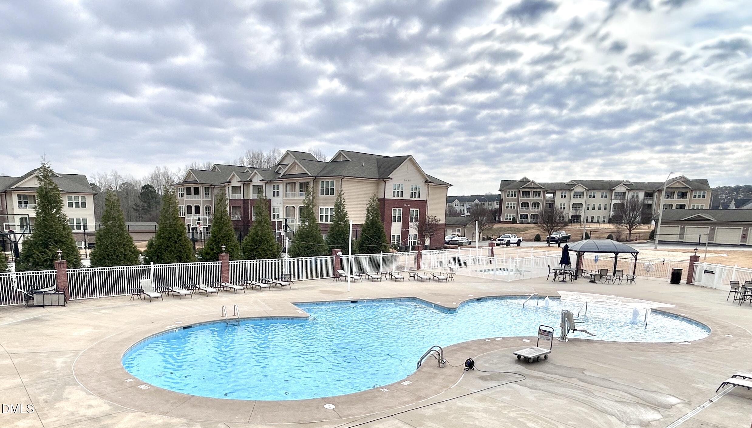 120 Misty Pike Drive Raleigh, NC 27603 - Photo 50 of 57 a view of a swimming pool with outdoor seating
