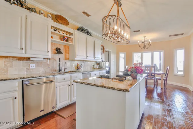 a bedroom with a bed and a dresser in it