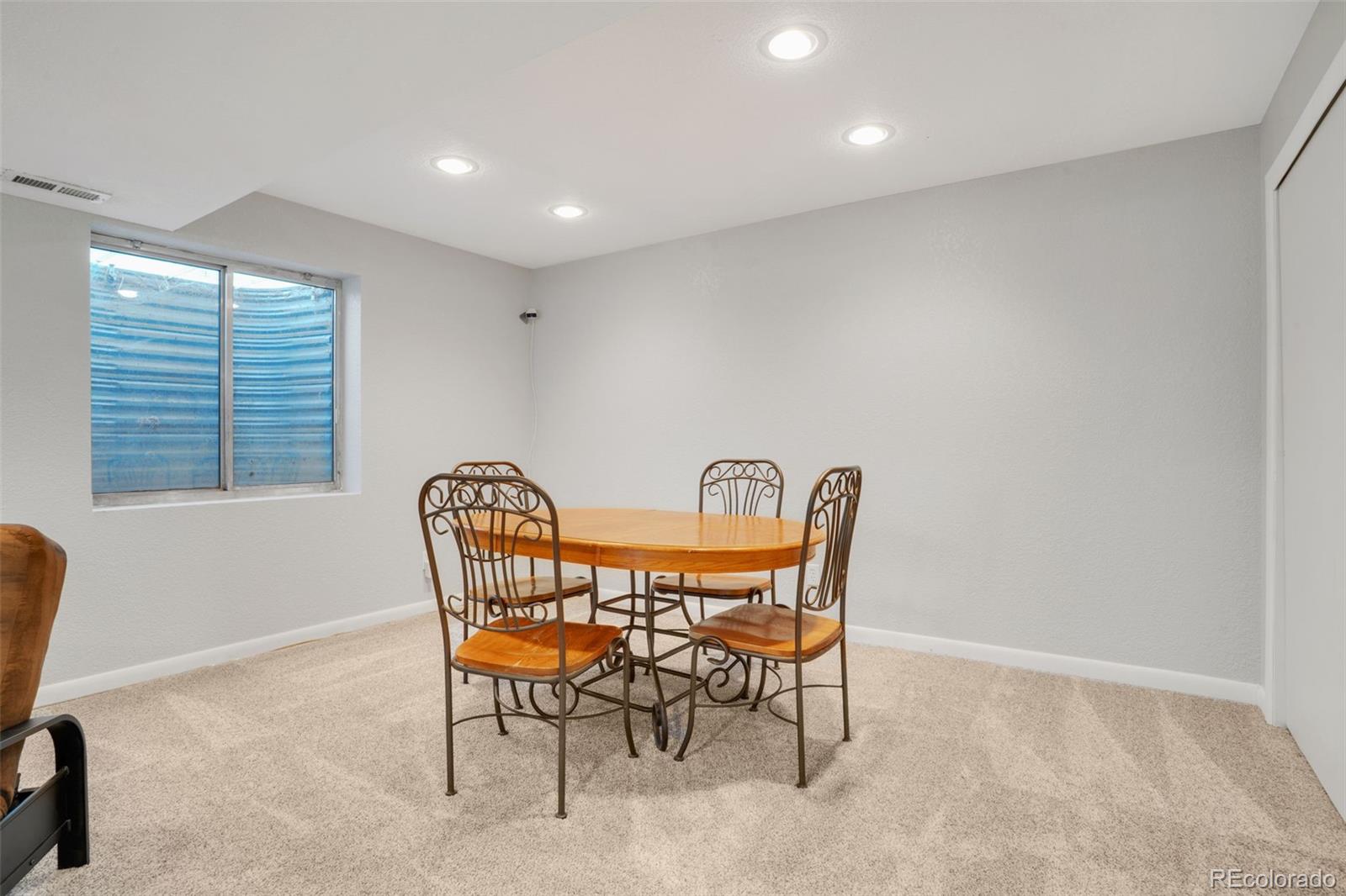 210 South Elm Street Bennett, CO 80102 - Photo 18 of 31 a dining room with furniture and window