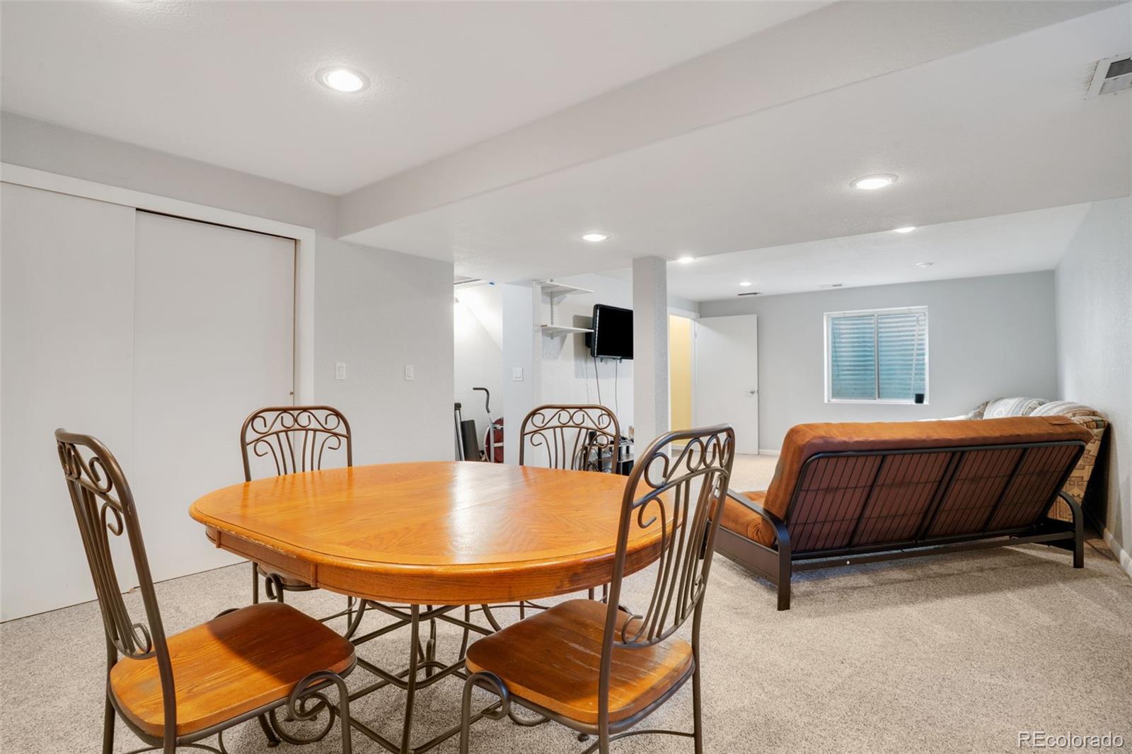 210 South Elm Street Bennett, CO 80102 - Photo 19 of 31 a dining room with furniture and window