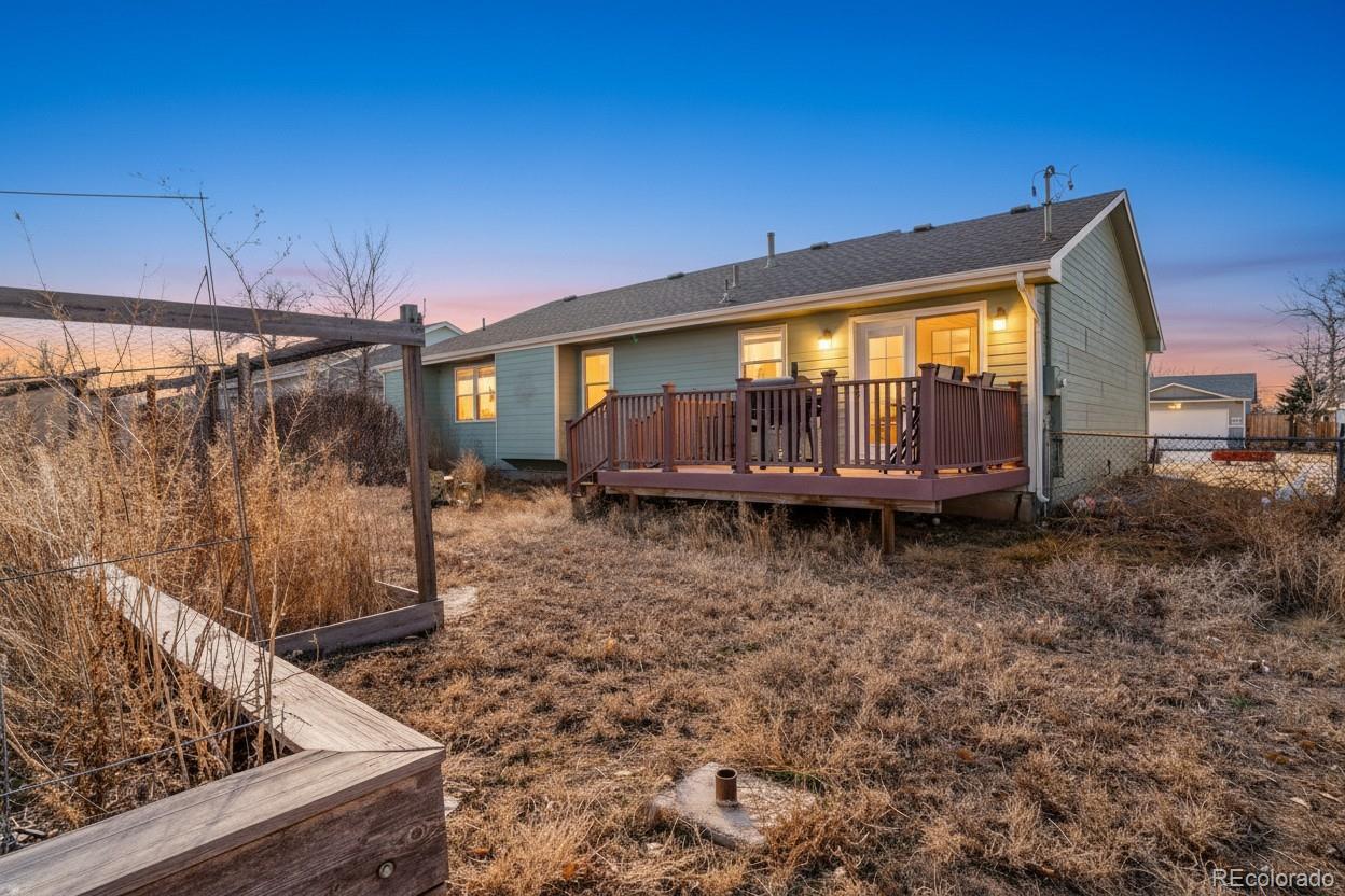 210 South Elm Street Bennett, CO 80102 - Photo 24 of 31 a backyard of a house with barbeque oven