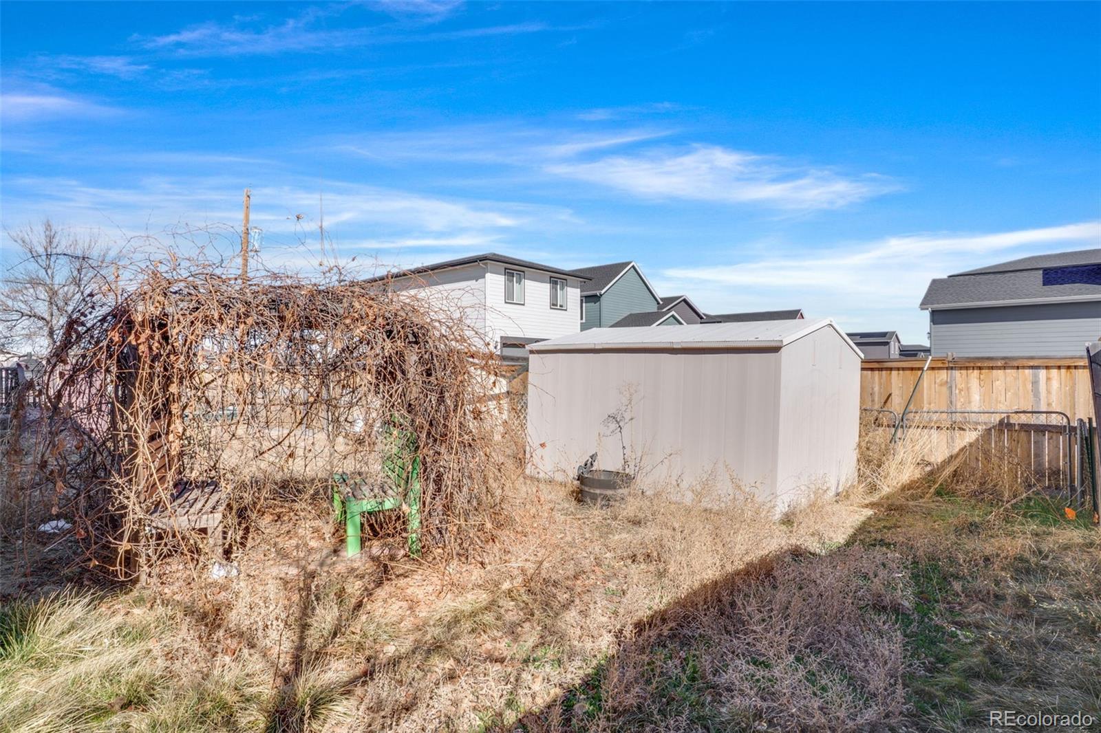 210 South Elm Street Bennett, CO 80102 - Photo 25 of 31 a view of a house with a yard