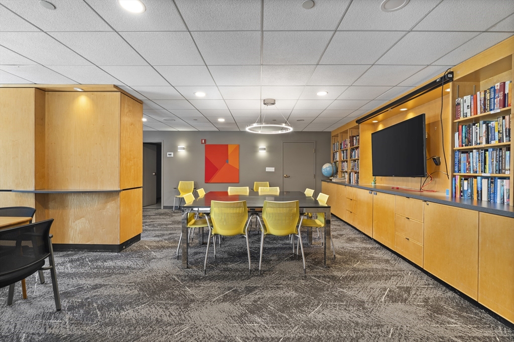 111 Perkins Street, Unit 261 Boston, MA 02130 - Photo 13 of 16 a view of a room with furniture and a flat screen tv