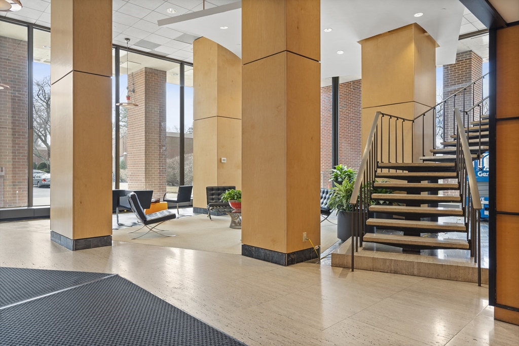 111 Perkins Street, Unit 261 Boston, MA 02130 - Photo 14 of 16 a view of a living room with balcony and furniture