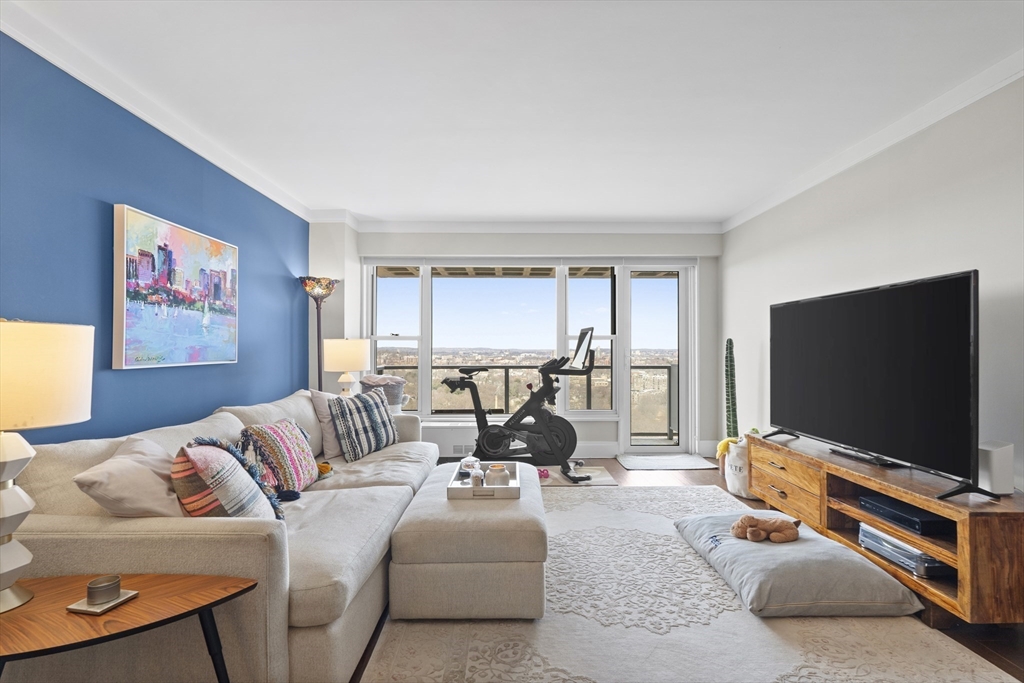 111 Perkins Street, Unit 261 Boston, MA 02130 - Photo 2 of 16 a living room with furniture and a flat screen tv