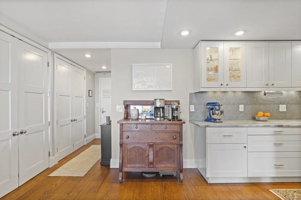 111 Perkins Street, Unit 261 Boston, MA 02130 - Photo 6 of 16 a kitchen with stainless steel appliances granite countertop a refrigerator and a stove
