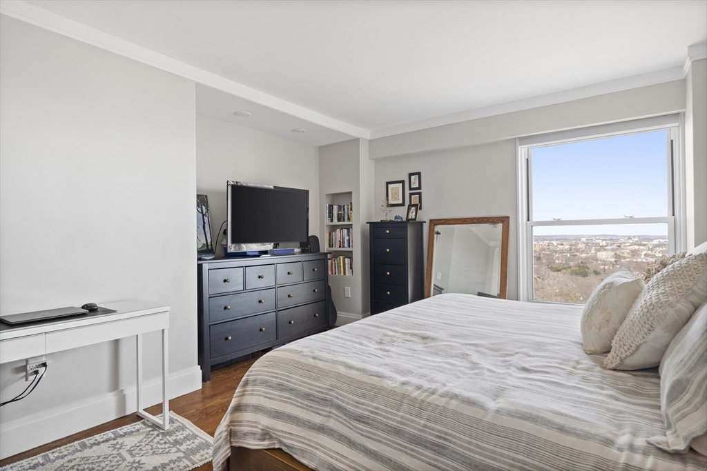 111 Perkins Street, Unit 261 Boston, MA 02130 - Photo 8 of 16 a bedroom with a bed and a flat screen tv