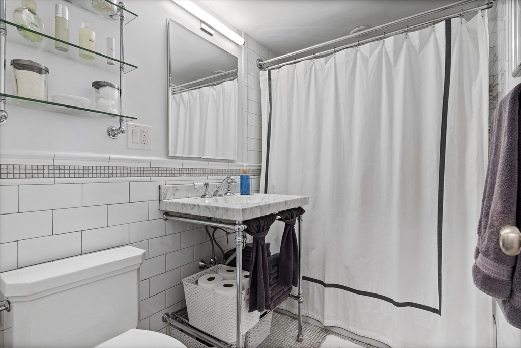 111 Perkins Street, Unit 261 Boston, MA 02130 - Photo 9 of 16 a bathroom with a sink a toilet and shower