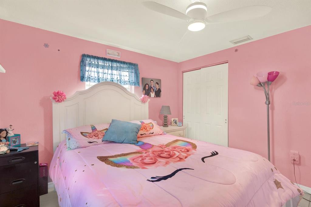 7415 Mayfield Drive Port Richey, FL 34668 - Photo 12 of 17 a bedroom with furniture and a bed