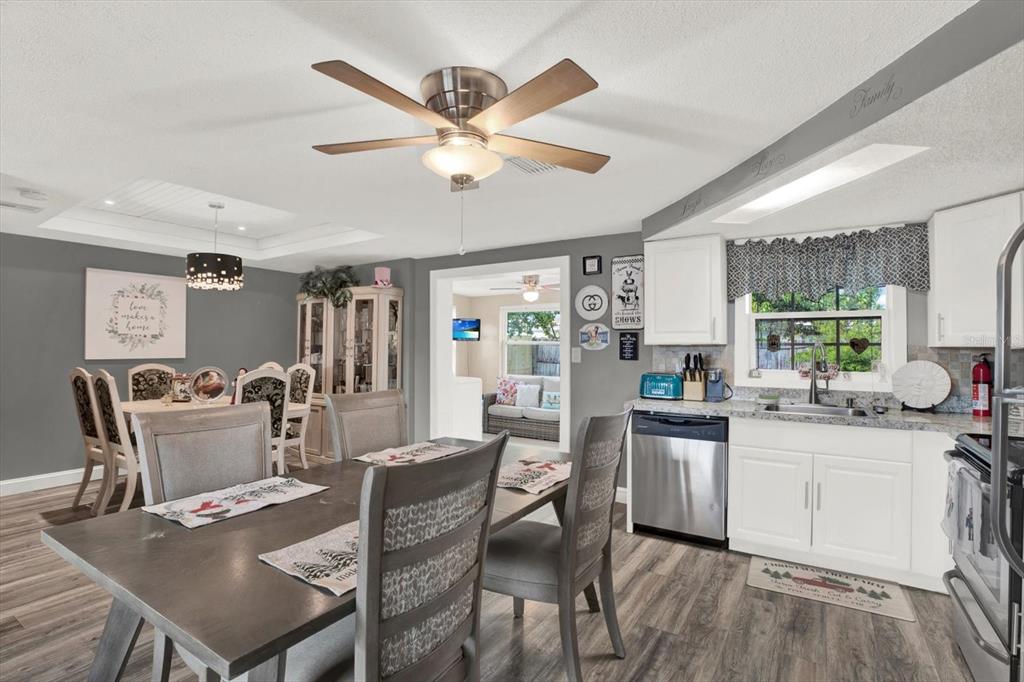 7415 Mayfield Drive Port Richey, FL 34668 - Photo 4 of 17 a view of a dining room with furniture and a large window