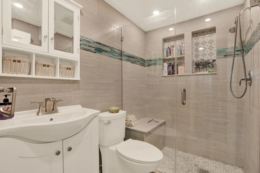 7415 Mayfield Drive Port Richey, FL 34668 - Photo 10 of 17 a bathroom with a sink toilet and shower