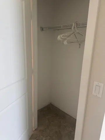 a view of storage and utility room with racks on the wall