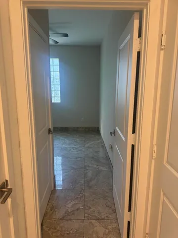a view of a bathroom with a glass door