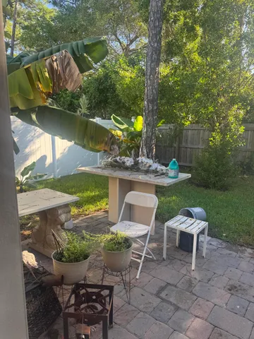 a yard with table and a chairs