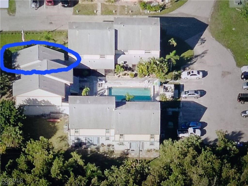 13446 Heald Lane, Unit 5B Fort Myers, FL 33908 - Photo 2 of 9 an aerial view of house with yard