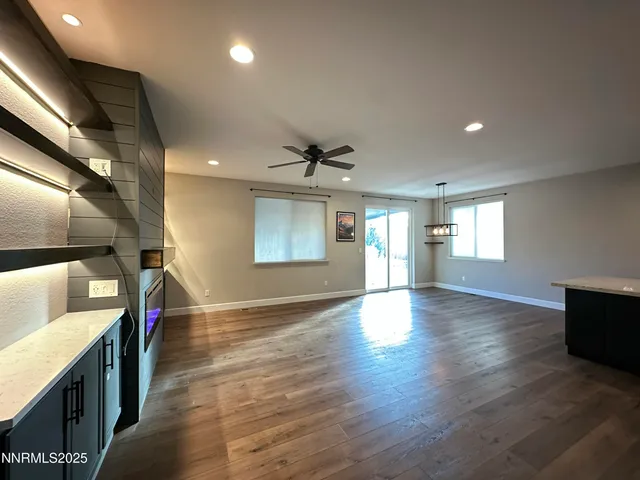 a kitchen with kitchen island a sink dishwasher a stove and black refrigerator