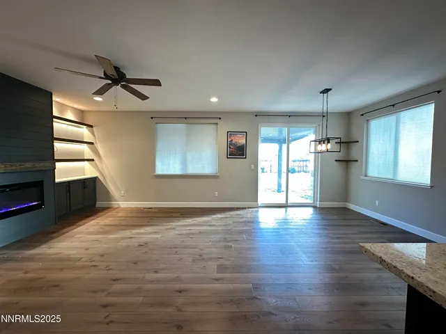 a view of kitchen and kitchen with wooden floor