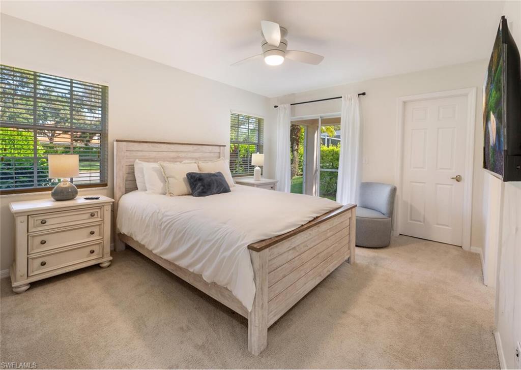2835 Mizzen Way Naples, FL 34109 - Photo 18 of 46 a bed room with a bed and a dresser