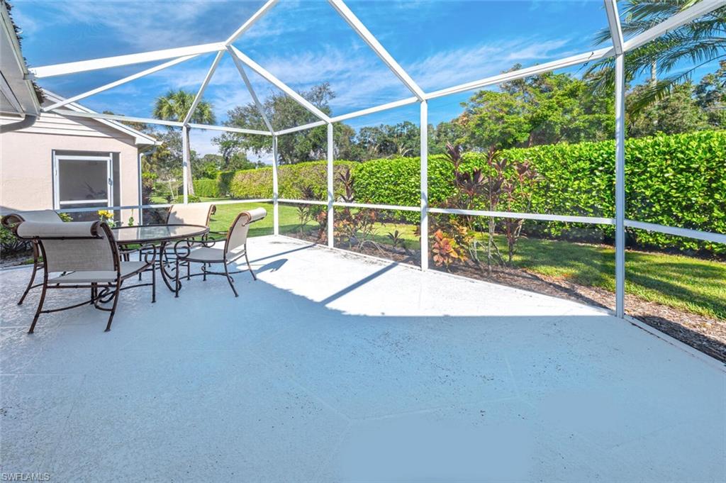 2835 Mizzen Way Naples, FL 34109 - Photo 27 of 46 a view of a house with backyard porch and sitting area