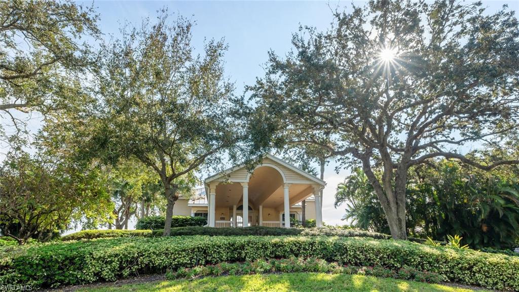 2835 Mizzen Way Naples, FL 34109 - Photo 33 of 46 a front view of a house with garden