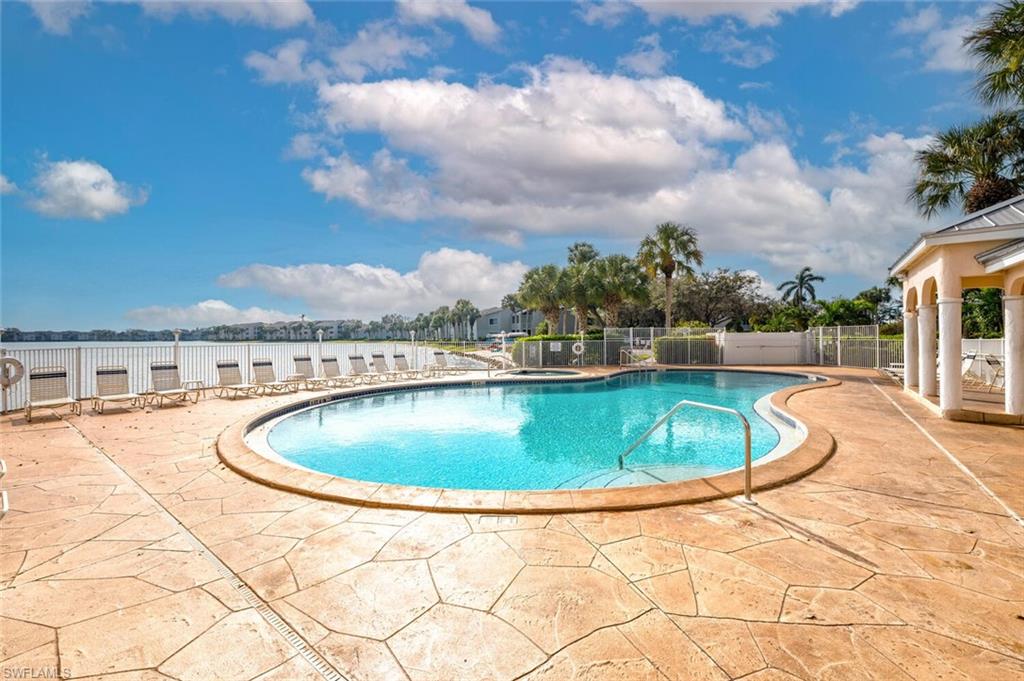 2835 Mizzen Way Naples, FL 34109 - Photo 34 of 46 a view of a swimming pool with a yard