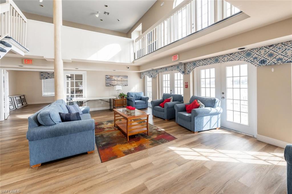 2835 Mizzen Way Naples, FL 34109 - Photo 36 of 46 a living room with furniture kitchen view and a large window