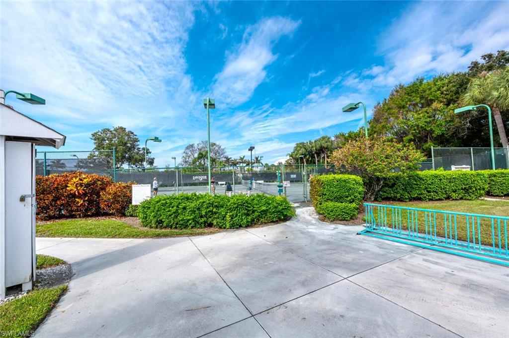 2835 Mizzen Way Naples, FL 34109 - Photo 42 of 46 a view of a garden with a house in the background