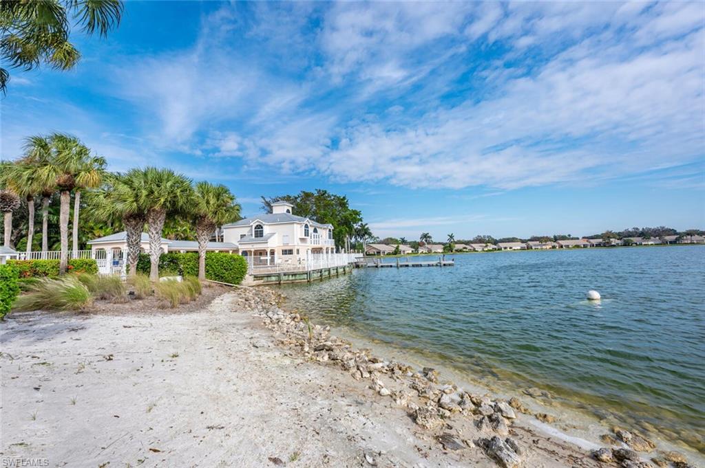 2835 Mizzen Way Naples, FL 34109 - Photo 43 of 46 a view of a lake with a big yard