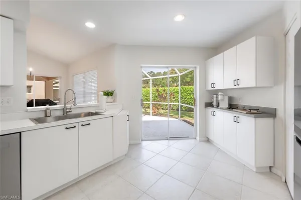 a kitchen with a sink and cabinets