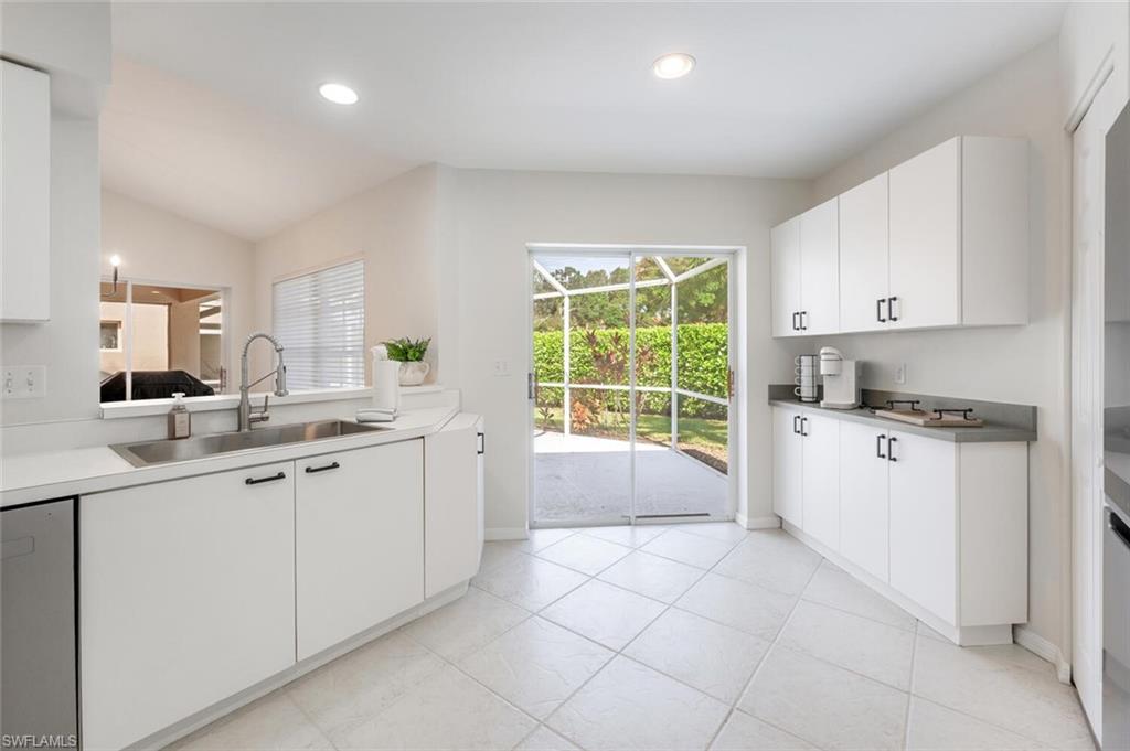 2835 Mizzen Way Naples, FL 34109 - Photo 10 of 46 a kitchen with a sink and cabinets