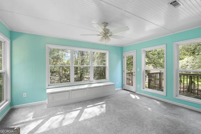 a view of an empty room with a window