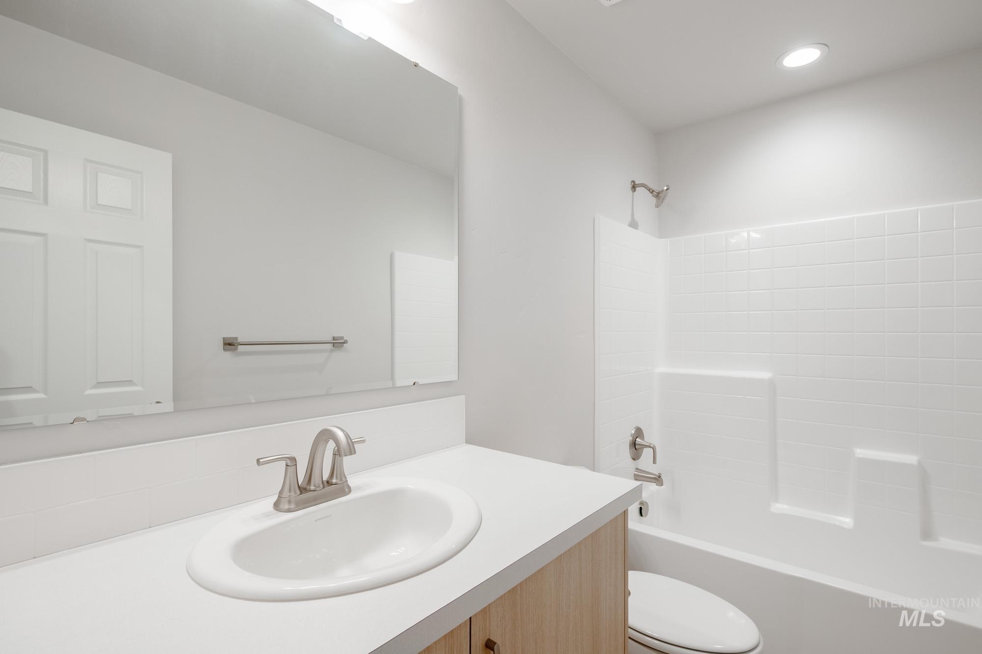 7472 South Menzingers Avenue Meridian, ID 83642 - Photo 17 of 22 Full bath featuring vanity, tub / shower combination, and recessed lighting