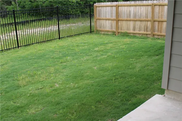 a view of backyard with green space