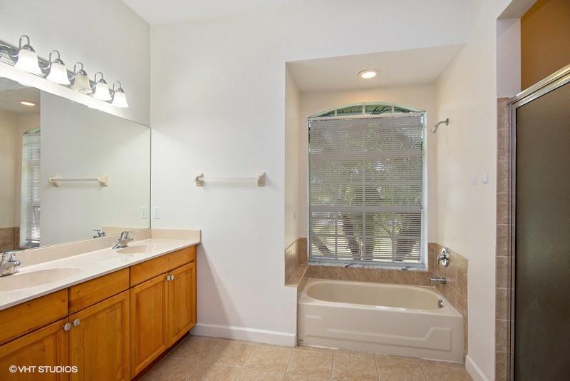 549 Southwest Aster Road Port St. Lucie, FL 34953 - Photo 8 of 12 09_549SWAsterRoad_13_MasterBathroom_Flex