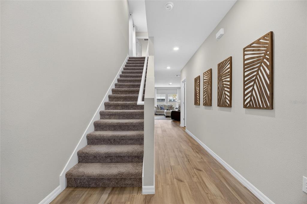 12908 Hawkstone Trail Boulevard Lithia, FL 33547 - Photo 18 of 76 a view of entryway and hall with wooden floor