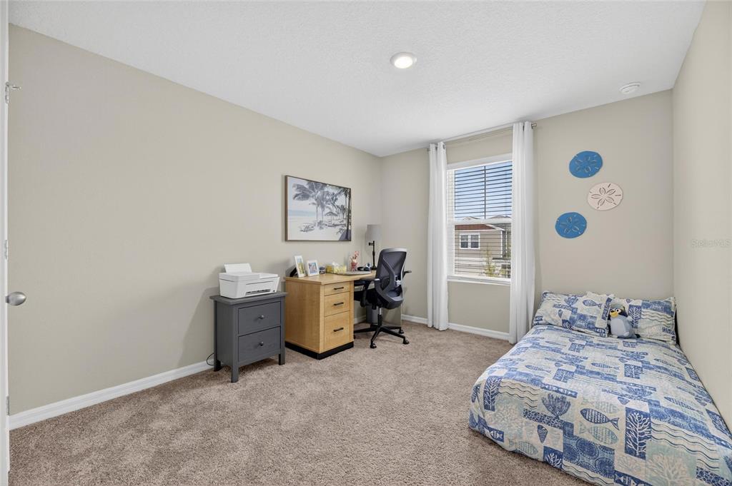 12908 Hawkstone Trail Boulevard Lithia, FL 33547 - Photo 33 of 76 a bedroom with a bed and a window