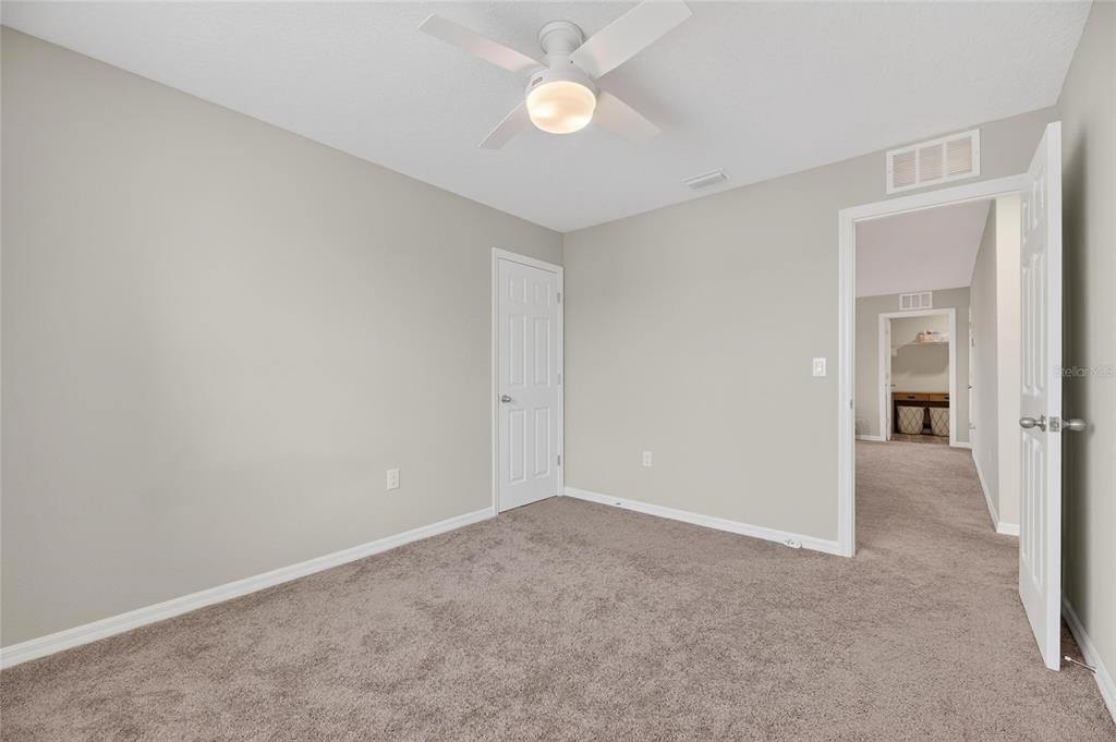 12908 Hawkstone Trail Boulevard Lithia, FL 33547 - Photo 39 of 76 a view of an empty room with closet and a window