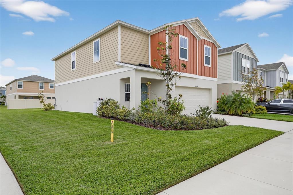 12908 Hawkstone Trail Boulevard Lithia, FL 33547 - Photo 47 of 76 a front view of a house with a yard