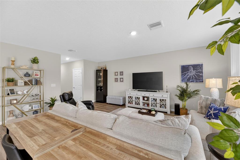 12908 Hawkstone Trail Boulevard Lithia, FL 33547 - Photo 6 of 76 a living room with furniture and a flat screen tv