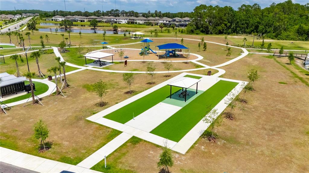 12908 Hawkstone Trail Boulevard Lithia, FL 33547 - Photo 64 of 76 a view of a swimming pool with a lake view