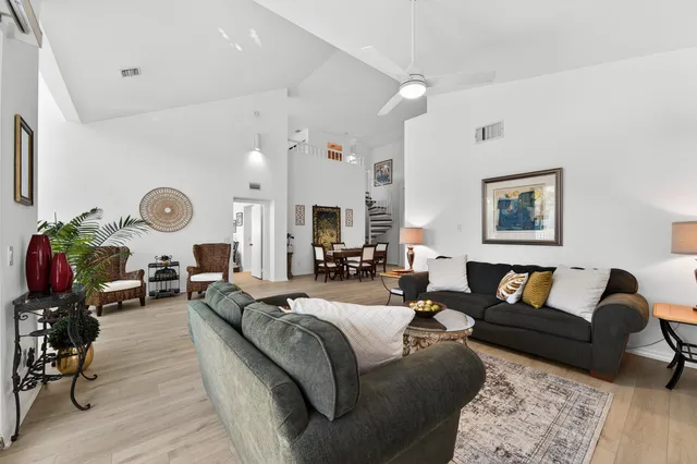 a view of a livingroom with furniture and a wooden floor