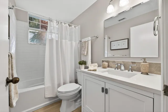 a bedroom with bed and a window