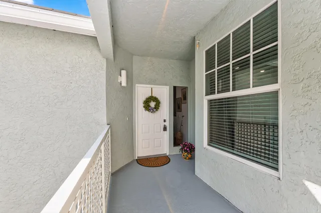 a front view of a house with parking space