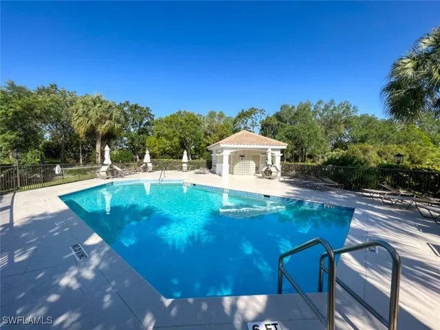 a view of a swimming pool with a patio