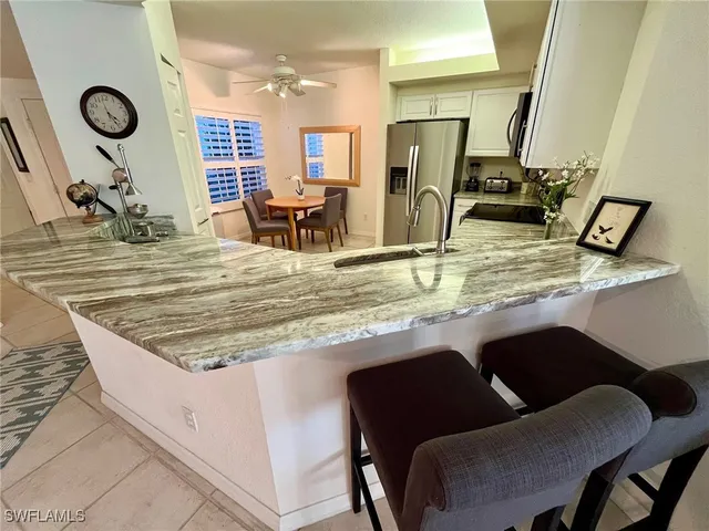 a view of a dining room with furniture and a wooden floor