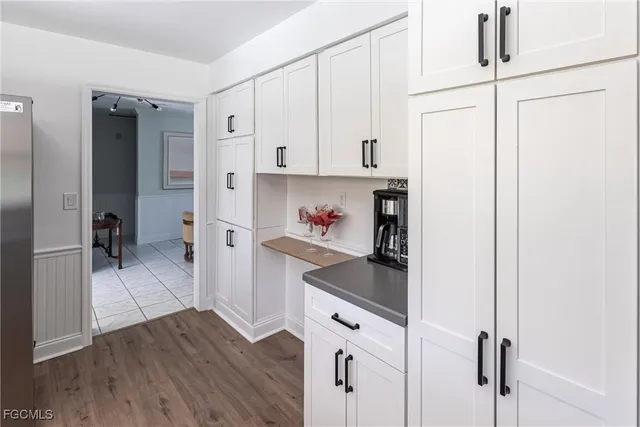 a kitchen with stainless steel appliances a refrigerator and a stove top oven
