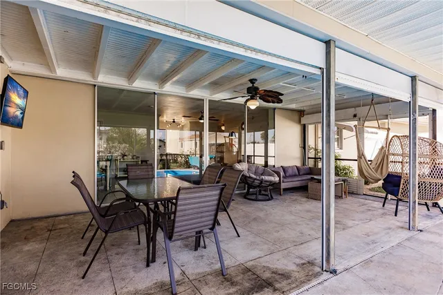 a view of a dining room with furniture window and outside view