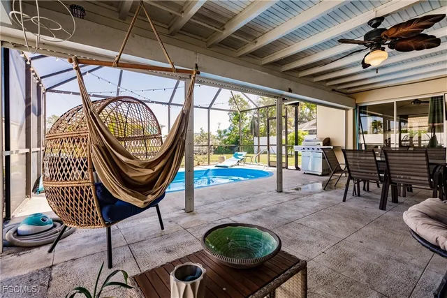 a view of a chairs and fire pit in a patio